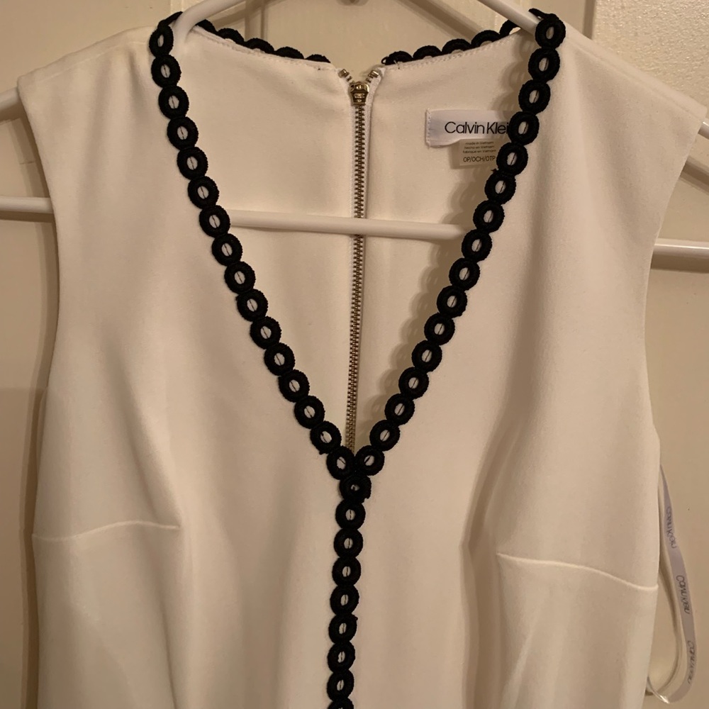 Calvin Klein new White Ruffle V Neck Mini dress. Brand new with tag - 0P.